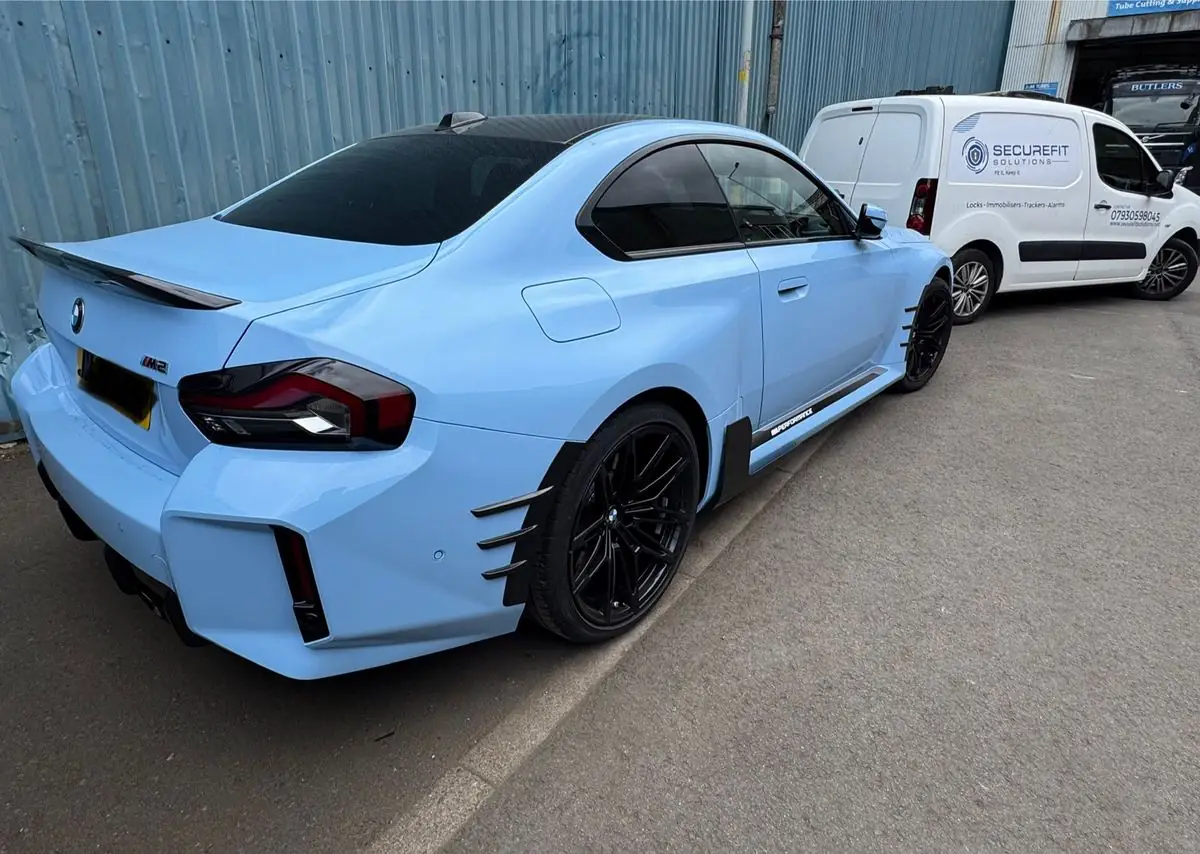 BMW M2 parked beside the SecureFit Solutions van after fitting
